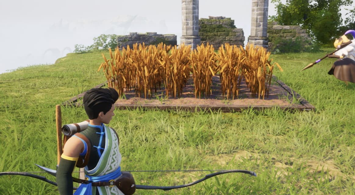 A player in Palworld looking over a field of Wheat.